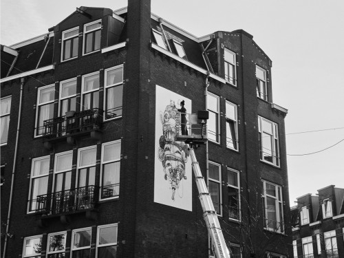 Schone kunst van Nouch, mural, muurschildering die vervuilde stadslucht opeet. Geschilderd in luchtzuiverende Airlite verf en Air-ink inkt