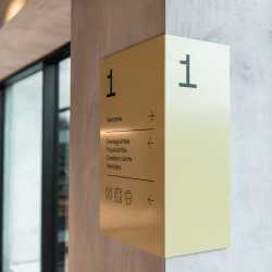 Signing - way finding, exterior signage in illuminated channel letters, totem signs in wood and brass for Hotel Pillows Zwolle