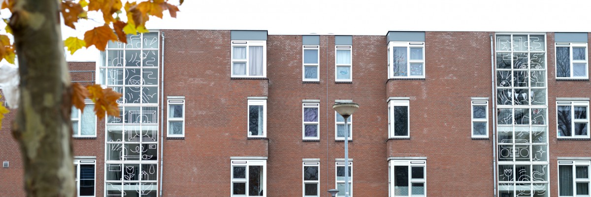 Illustrations by artist Gino Bud Hoiting in foil on windows of houses Almere