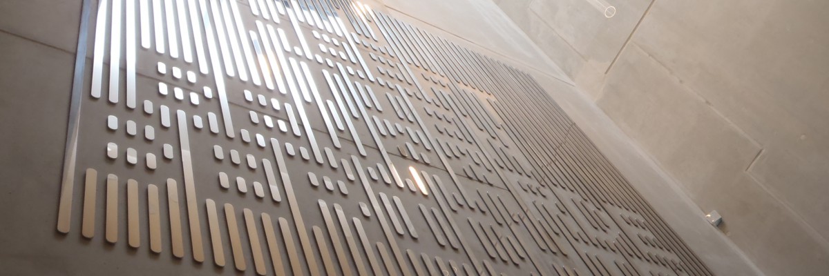 Typographic artwork in stainless steel by Martijn Sandberg in synagogue Amsterdam