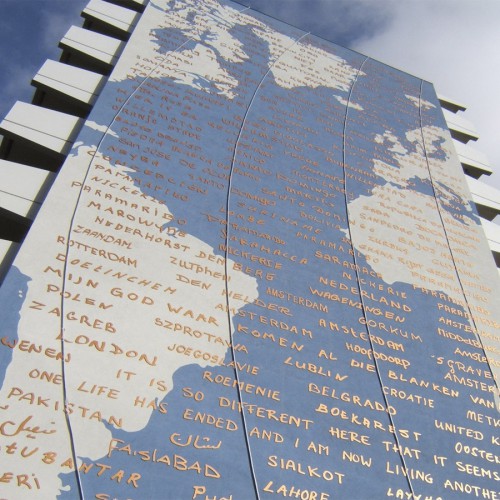 Artwork Marieken Verheyen on Bijlmerflat Amsterdam, continents as mural, meridians milled in neon and text