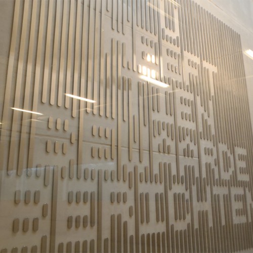 Typographic artwork in stainless steel by Martijn Sandberg in synagogue Amsterdam